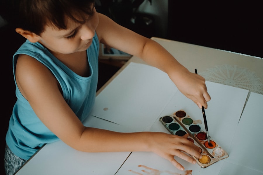 A child making a colorful paper craft
